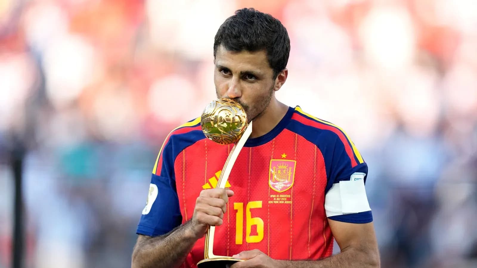 Player kissing trophy after winning the tournament Player kissing trophy after winning the tournament