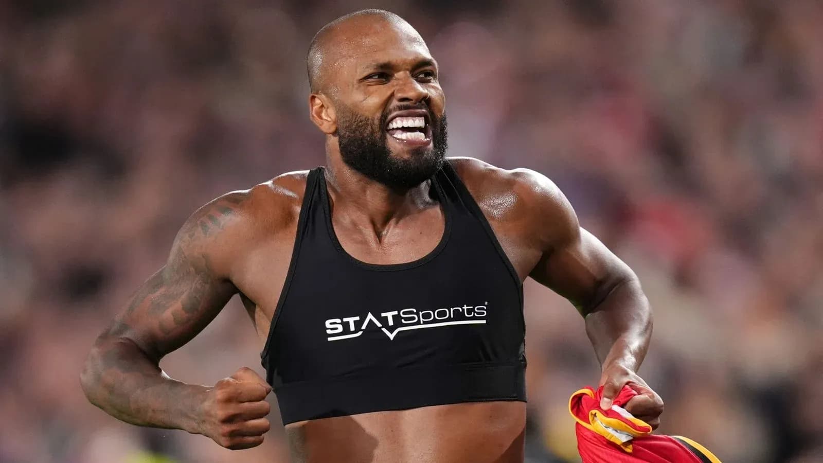 Athlete celebrating after a successful performance Athlete celebrating after a successful performance