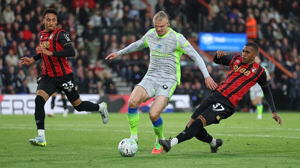 Erling Haaland dribbling past Bournemouth defenders Erling Haaland dribbling past Bournemouth defenders