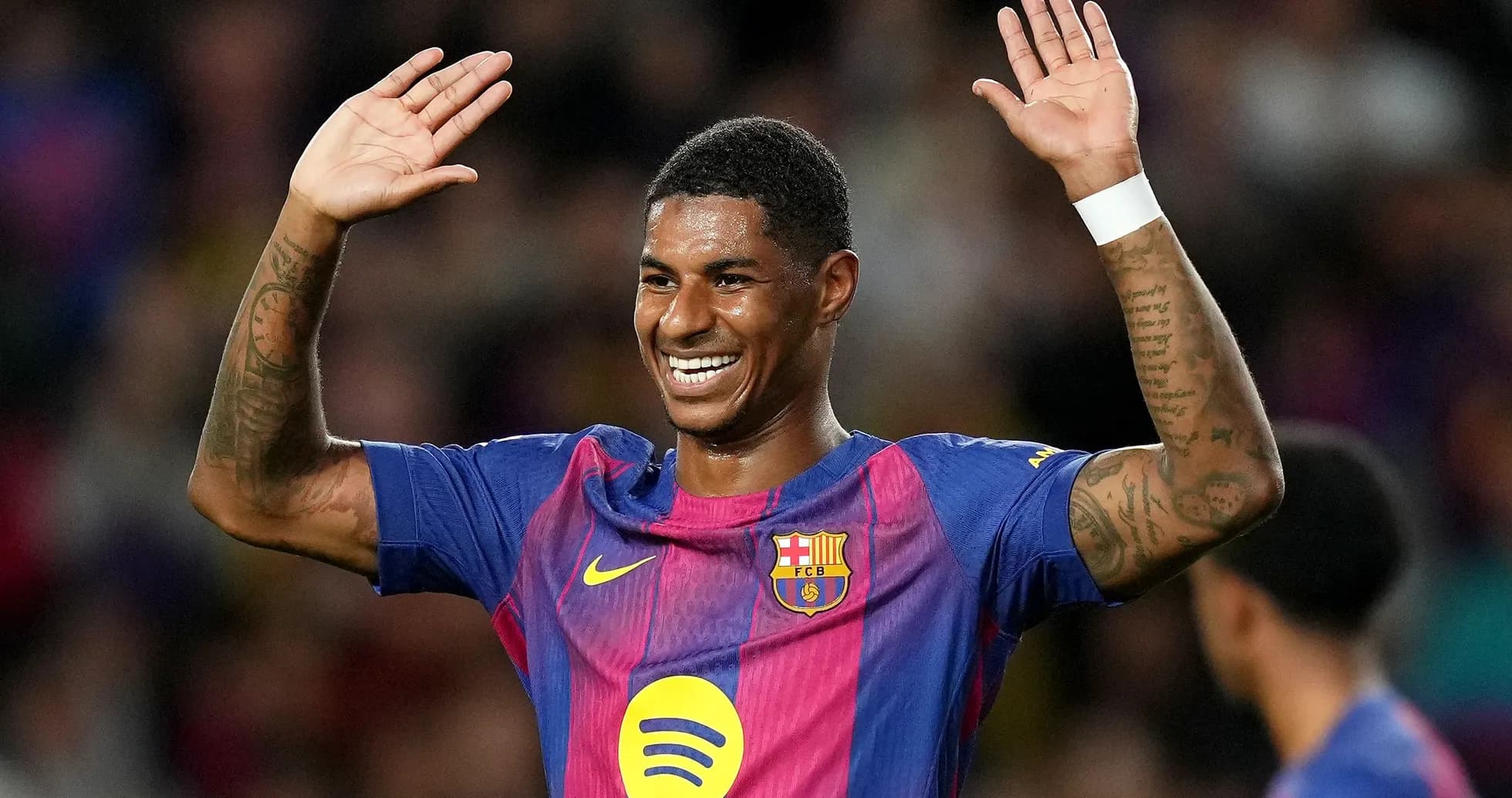 Player celebrating with raised hands in Barcelona jersey Player celebrating with raised hands in Barcelona jersey