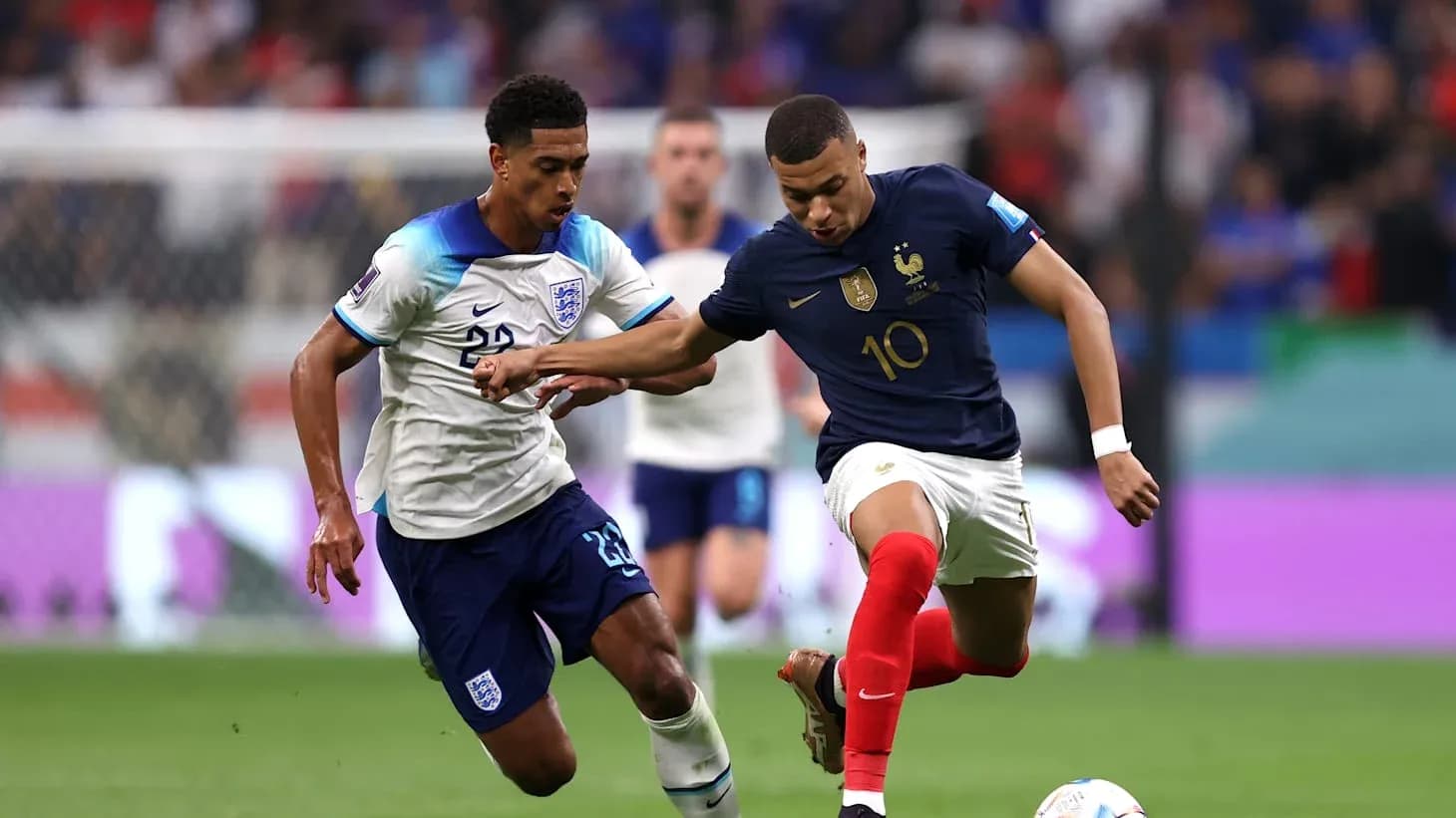 Mbappe and player competing for the ball Mbappe and player competing for the ball
