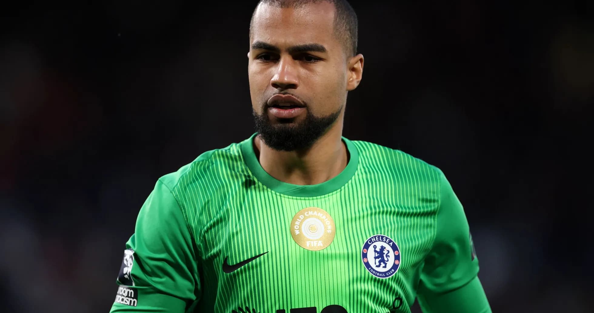 Goalkeeper wearing green kit during match Goalkeeper wearing green kit during match