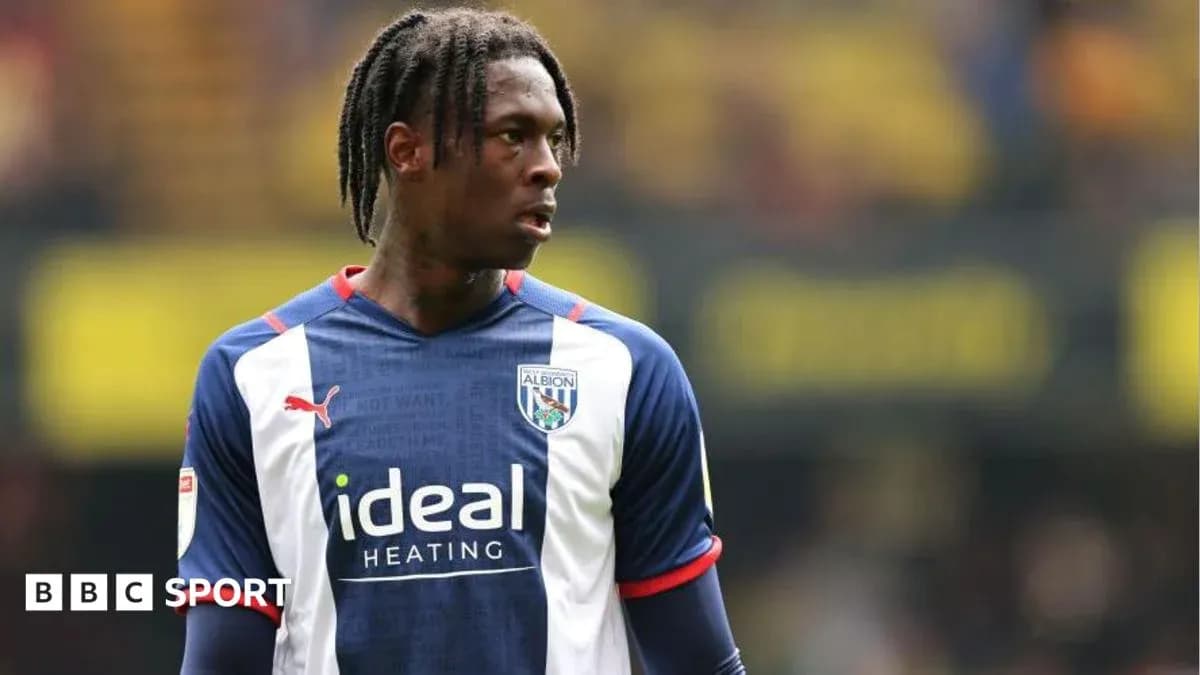 Player in West Bromwich Albion jersey on the pitch Player in West Bromwich Albion jersey on the pitch