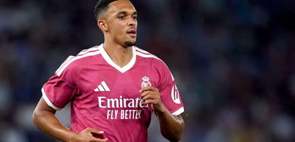 Player running in pink Real Madrid jersey Player running in pink Real Madrid jersey