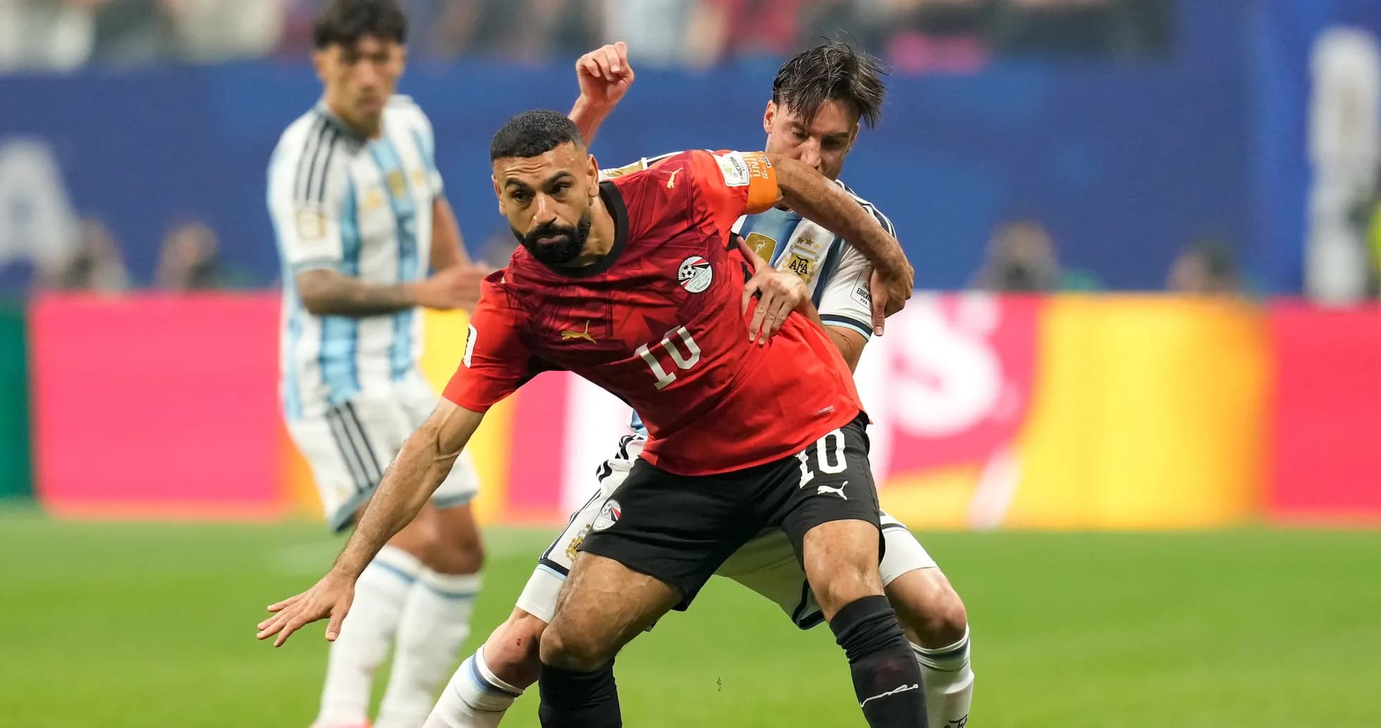 Egyptian player tackled by Argentine opponent during match Egyptian player tackled by Argentine opponent during match