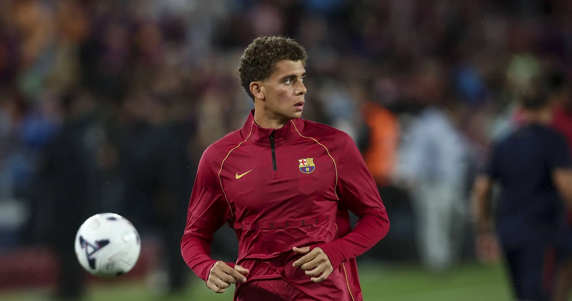 Player warming up in Barcelona training gear Player warming up in Barcelona training gear