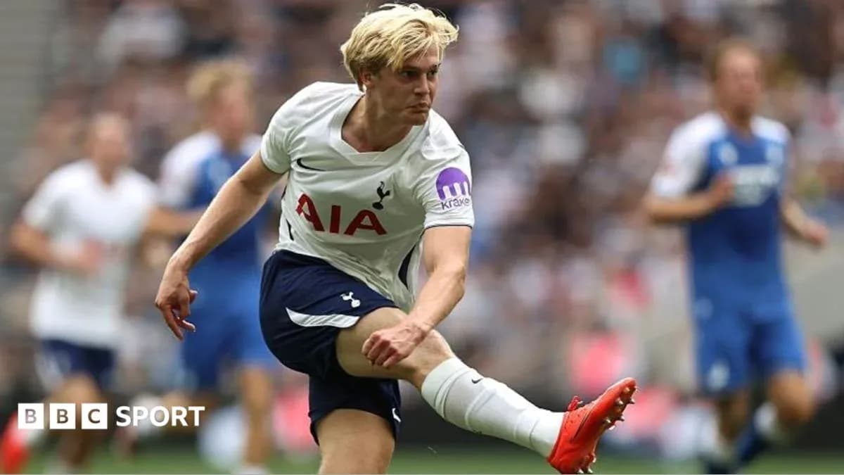 Player kicking the ball during a match Player kicking the ball during a match