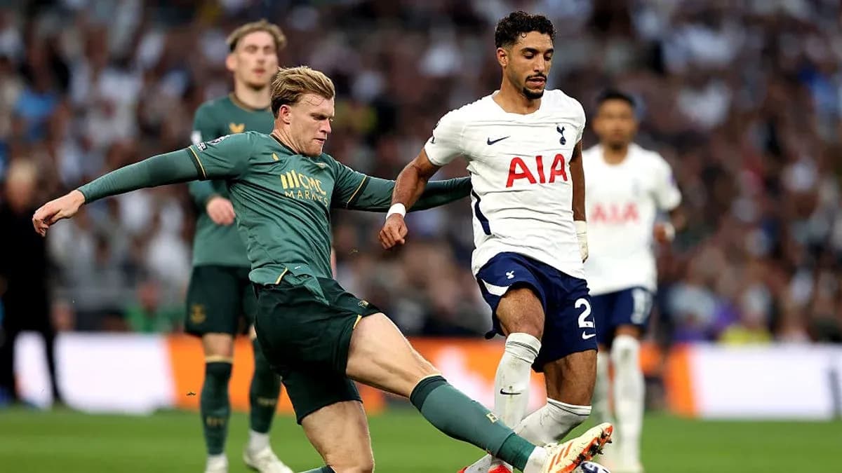 Player tackling opponent during a football match Player tackling opponent during a football match