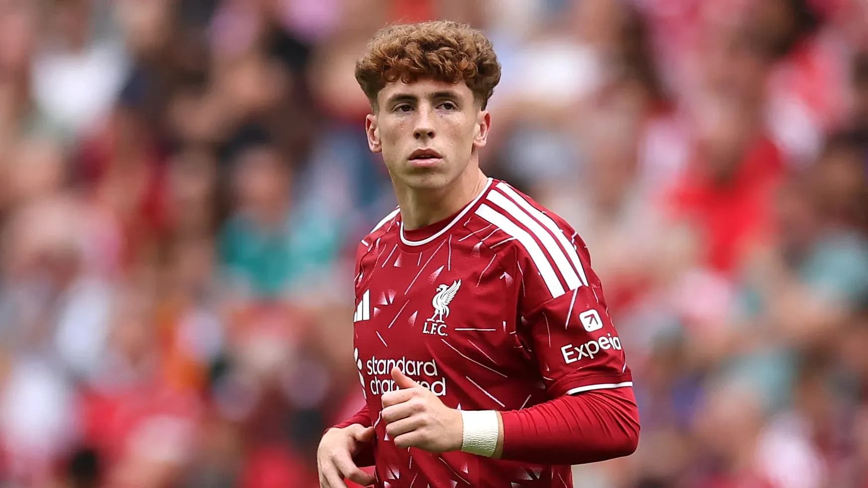 Player in Liverpool jersey during match on field Player in Liverpool jersey during match on field