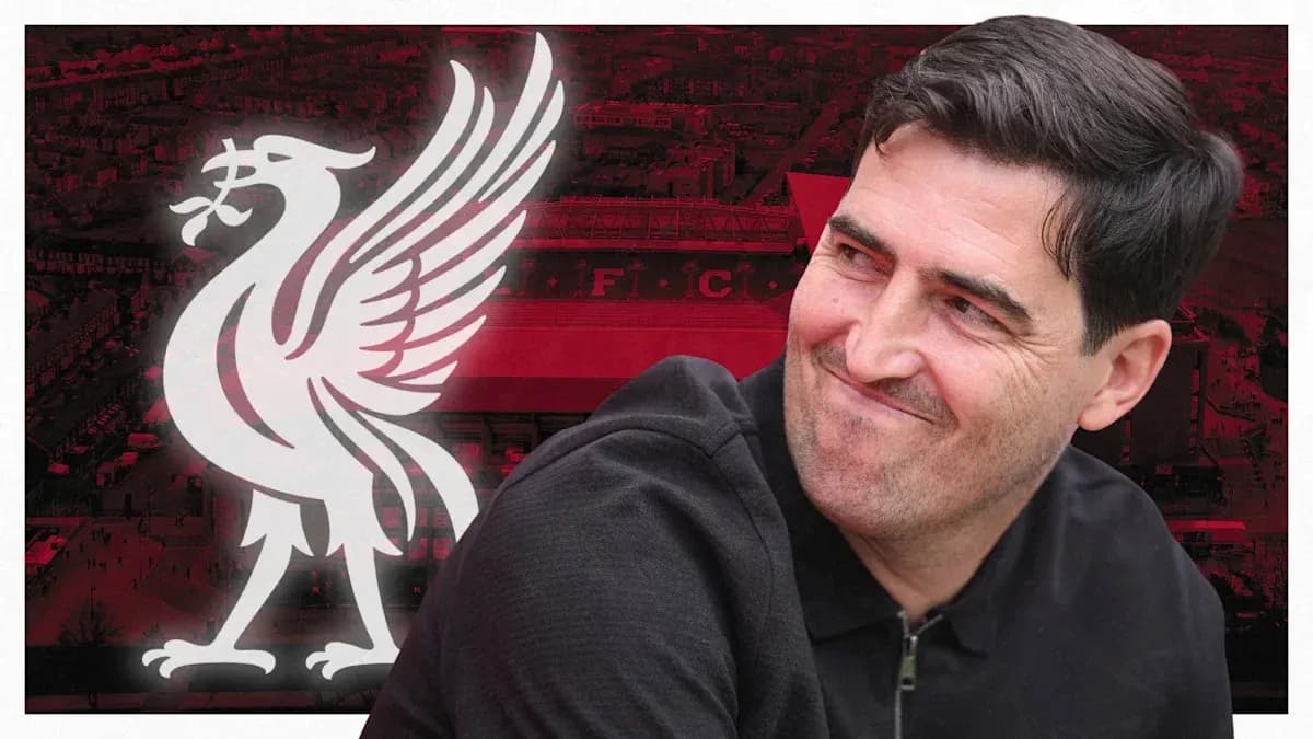 Man smiling with Liverpool logo in background Man smiling with Liverpool logo in background