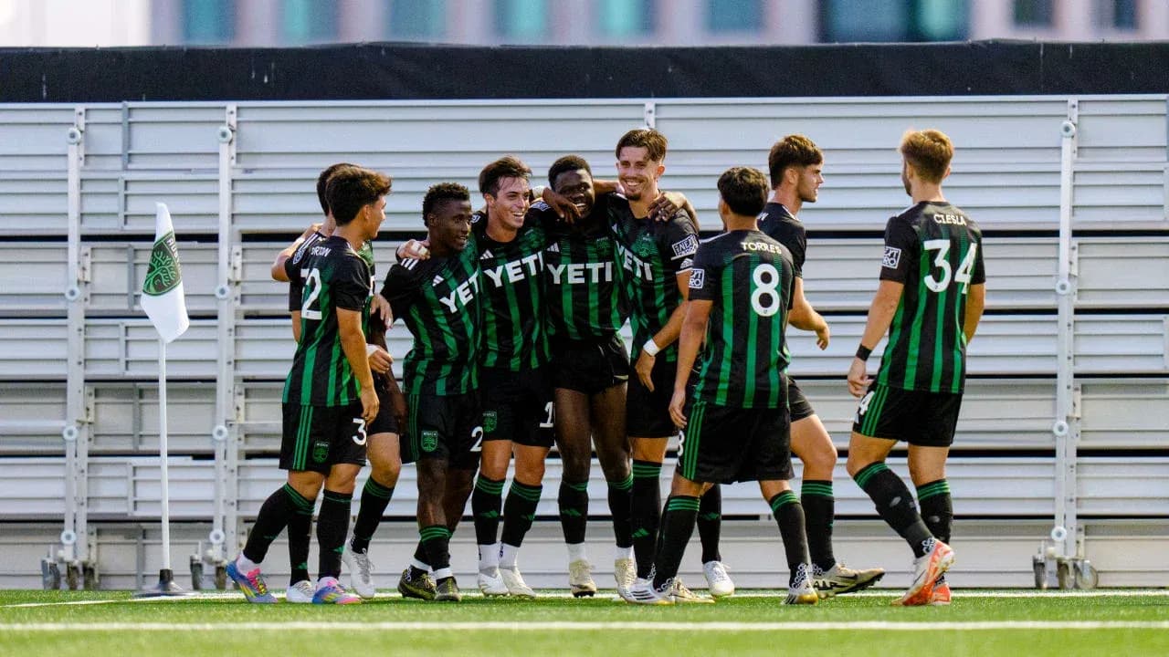 Players celebrating a goal during match Players celebrating a goal during match