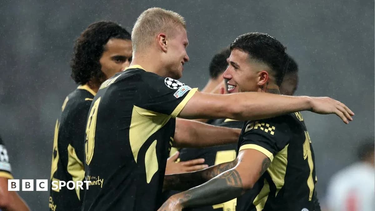 Two players celebrating a goal together on field Two players celebrating a goal together on field