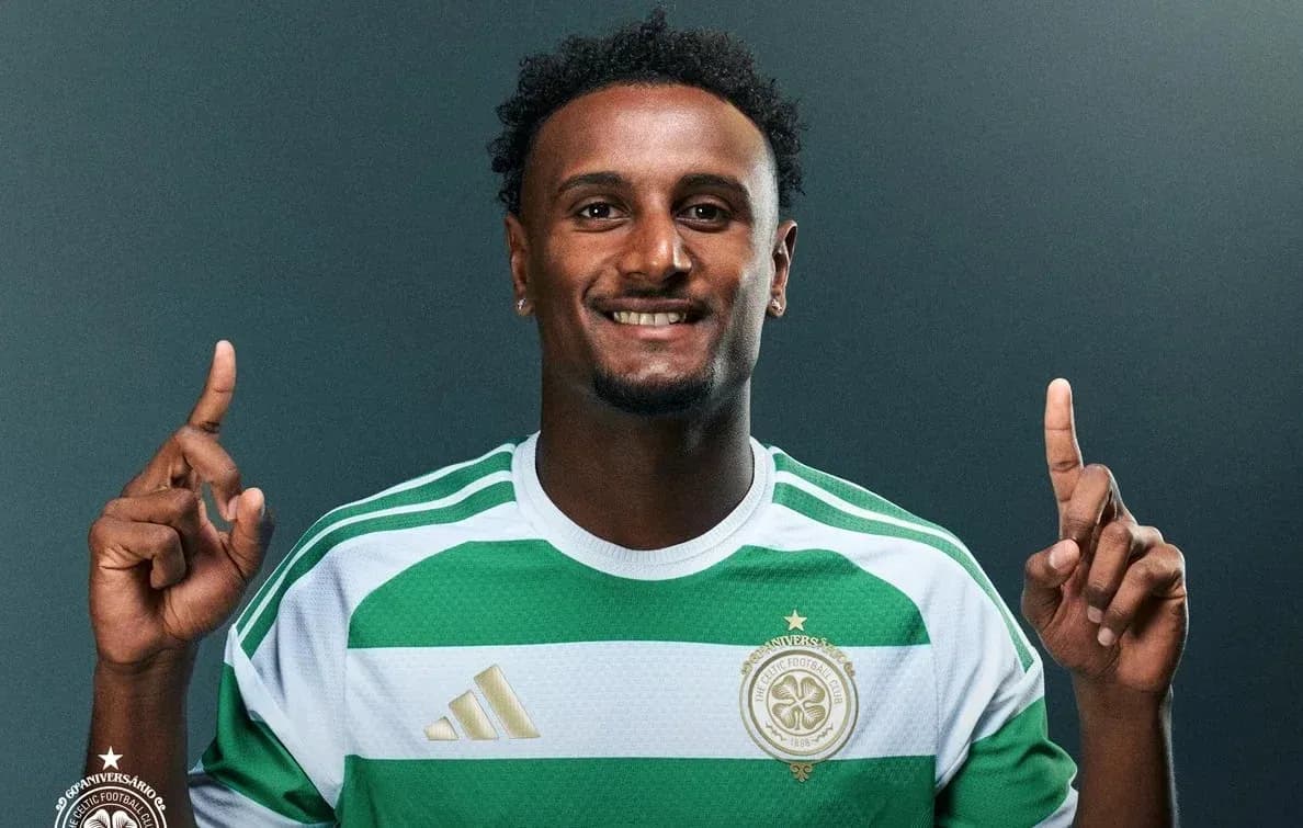 Player in green and white jersey pointing upwards Player in green and white jersey pointing upwards