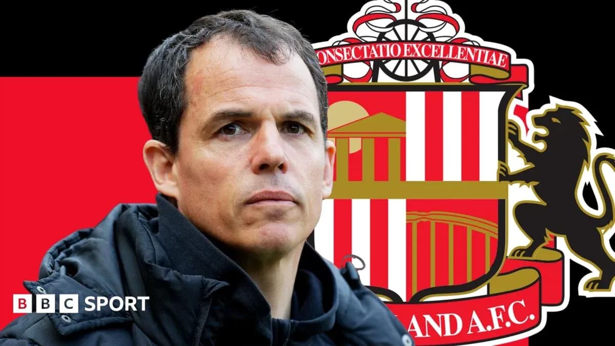 Coach in front of Sunderland AFC logo backdrop Coach in front of Sunderland AFC logo backdrop