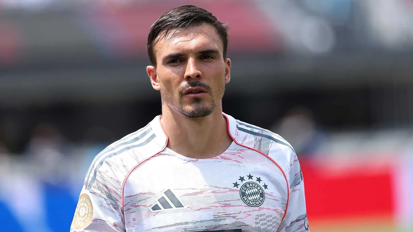 Player wearing Bayern Munich jersey on field Player wearing Bayern Munich jersey on field