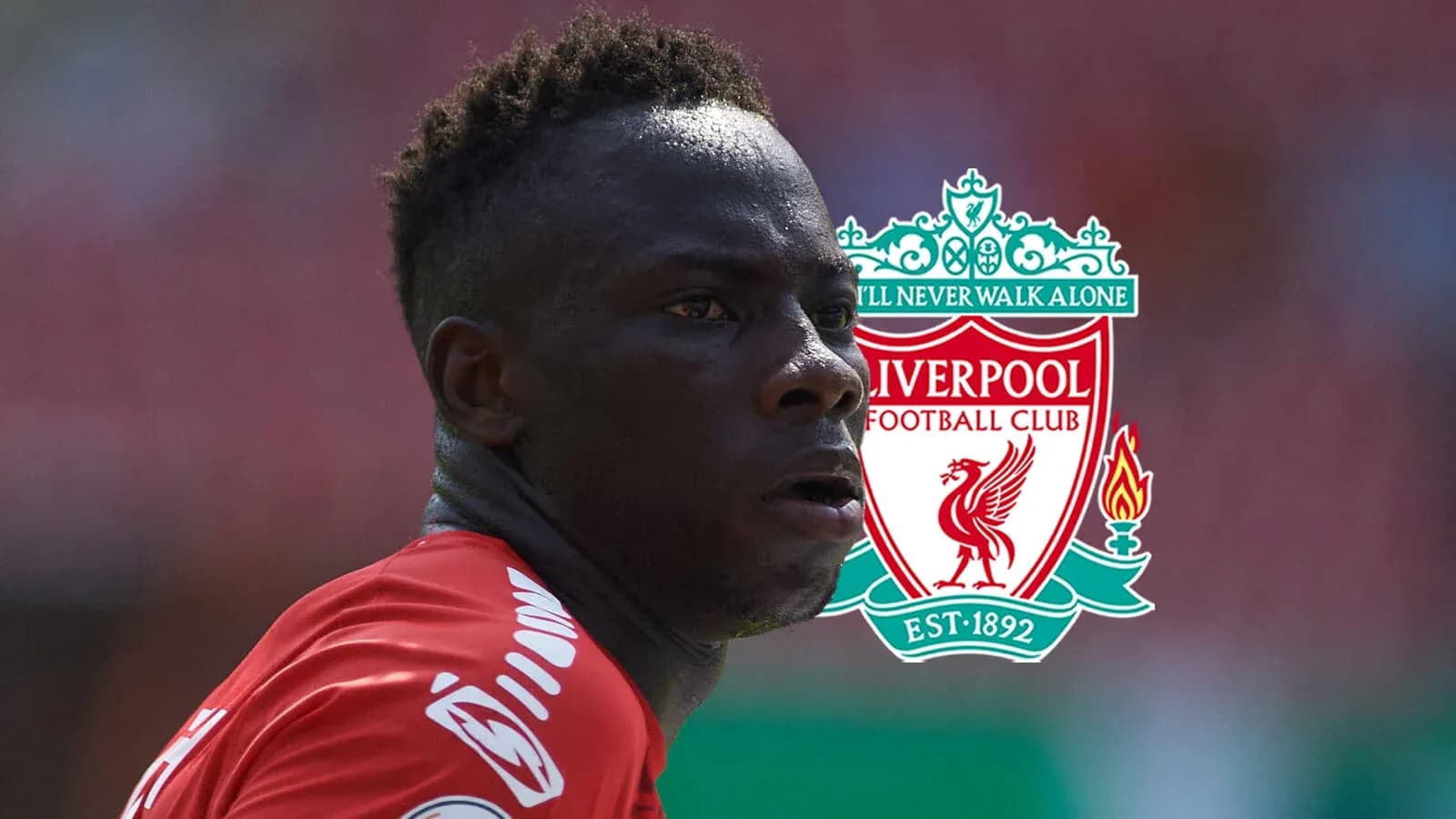 Player in Liverpool kit with club logo background Player in Liverpool kit with club logo background