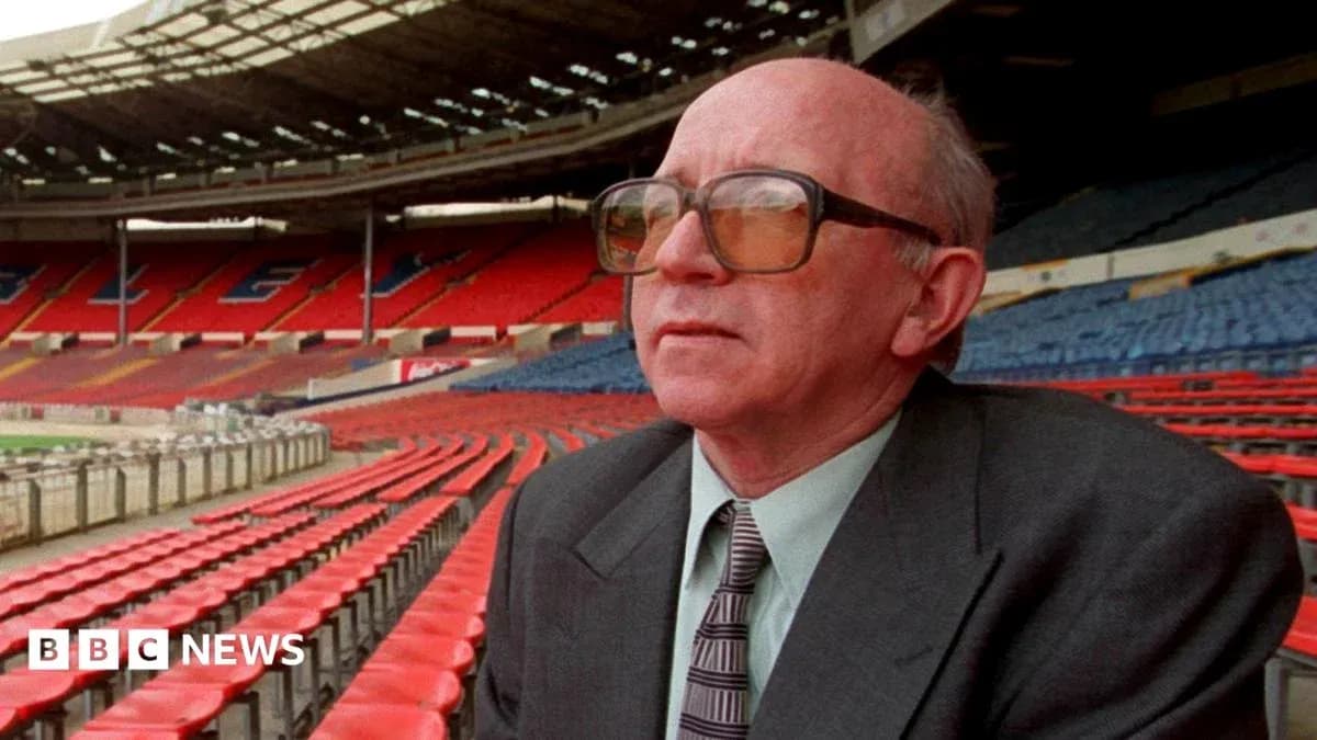Person seated in empty stadium looking ahead Person seated in empty stadium looking ahead