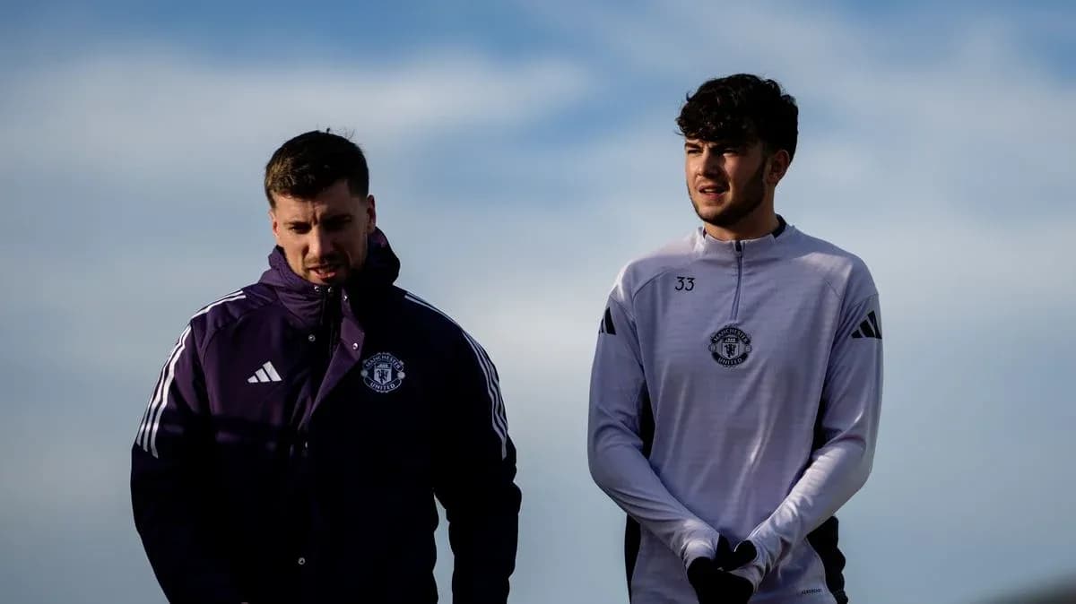 Two Manchester United players walking outdoors Two Manchester United players walking outdoors
