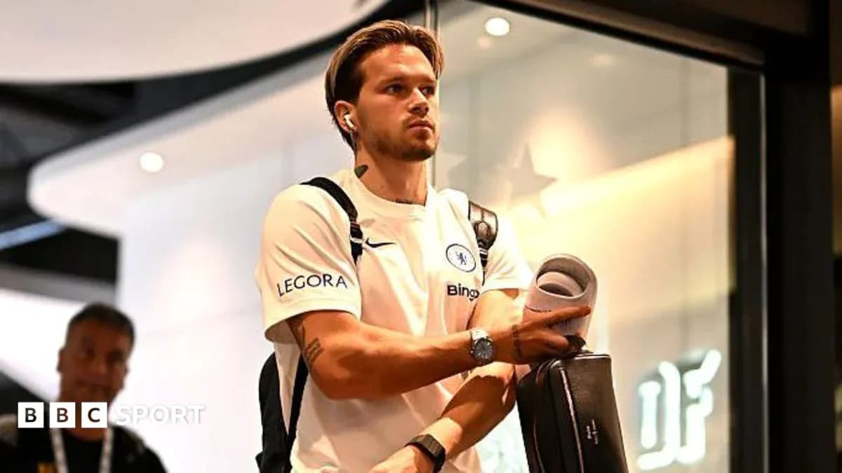 Player arriving at venue carrying sports equipment Player arriving at venue carrying sports equipment