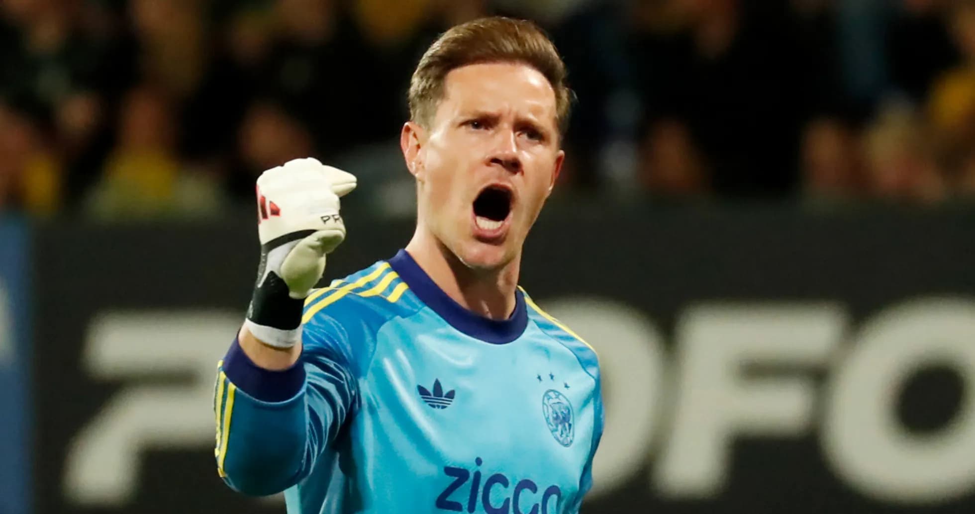 Goalkeeper celebrating with raised fist during match Goalkeeper celebrating with raised fist during match
