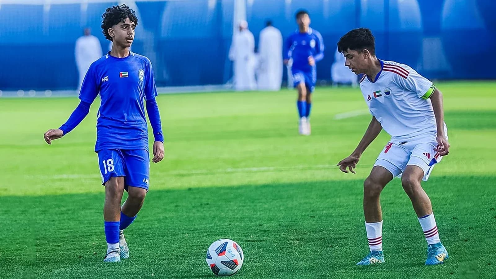 Ittihad Kalba U23 player dribbling against Al Nasr U23 Ittihad Kalba U23 player dribbling against Al Nasr U23