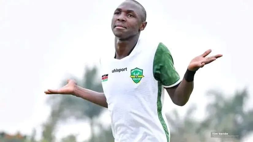 Player celebrating with arms raised during match Player celebrating with arms raised during match