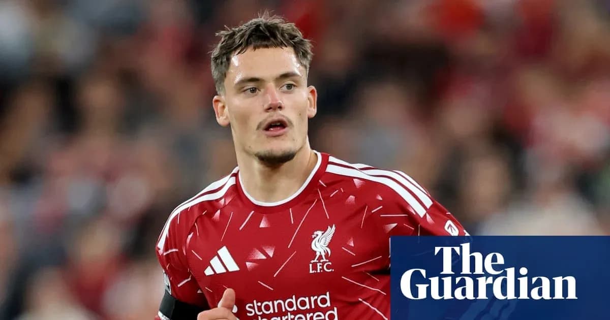 Player in Liverpool FC kit during match Player in Liverpool FC kit during match