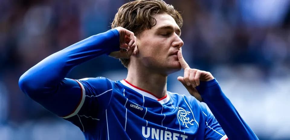 Player celebrating with finger to lips during match Player celebrating with finger to lips during match