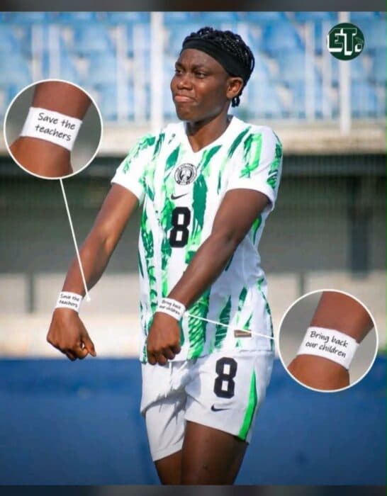Player wearing jersey with protest messages on wrists Player wearing jersey with protest messages on wrists