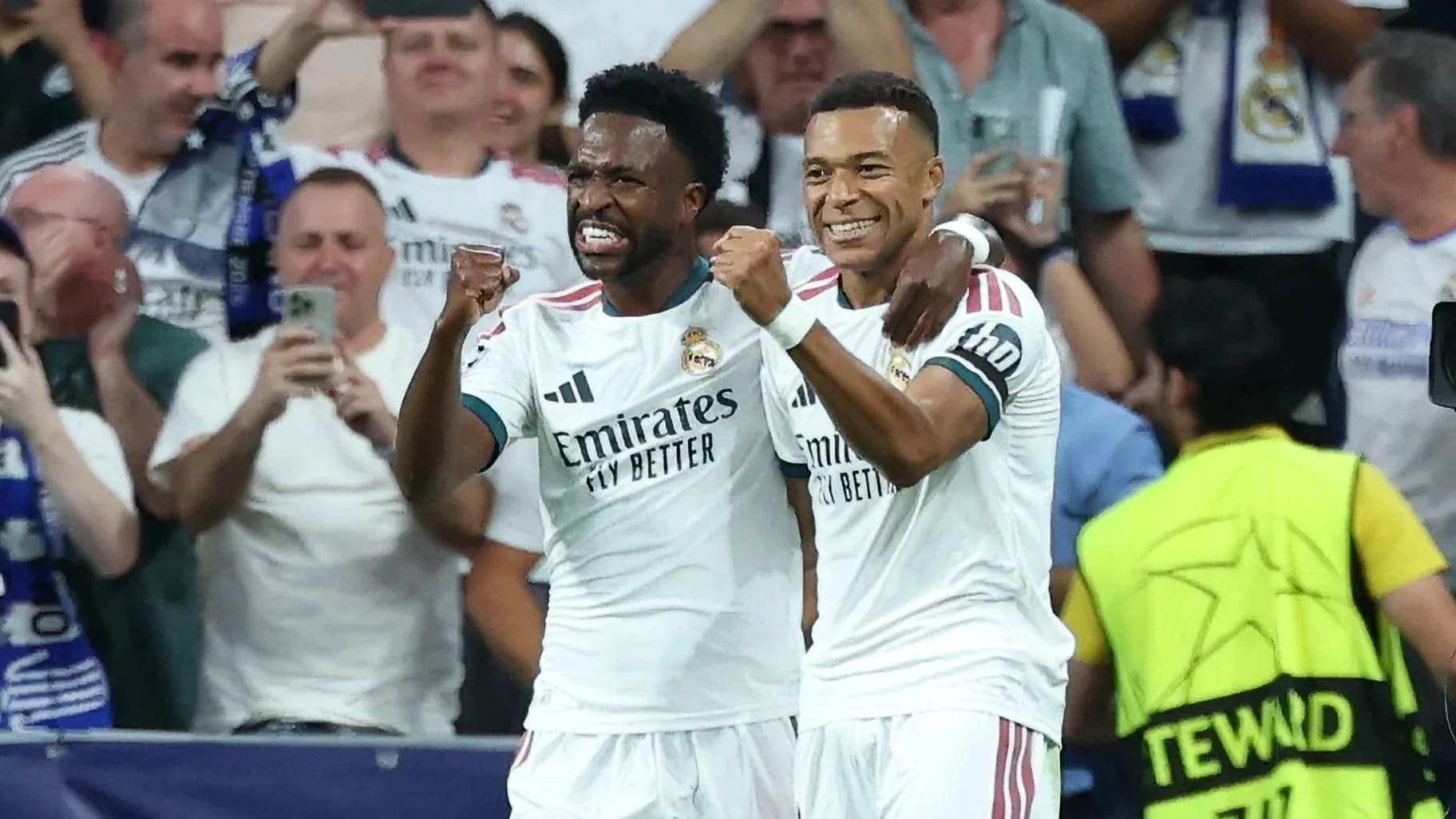 Two Real Madrid players celebrating a goal Two Real Madrid players celebrating a goal