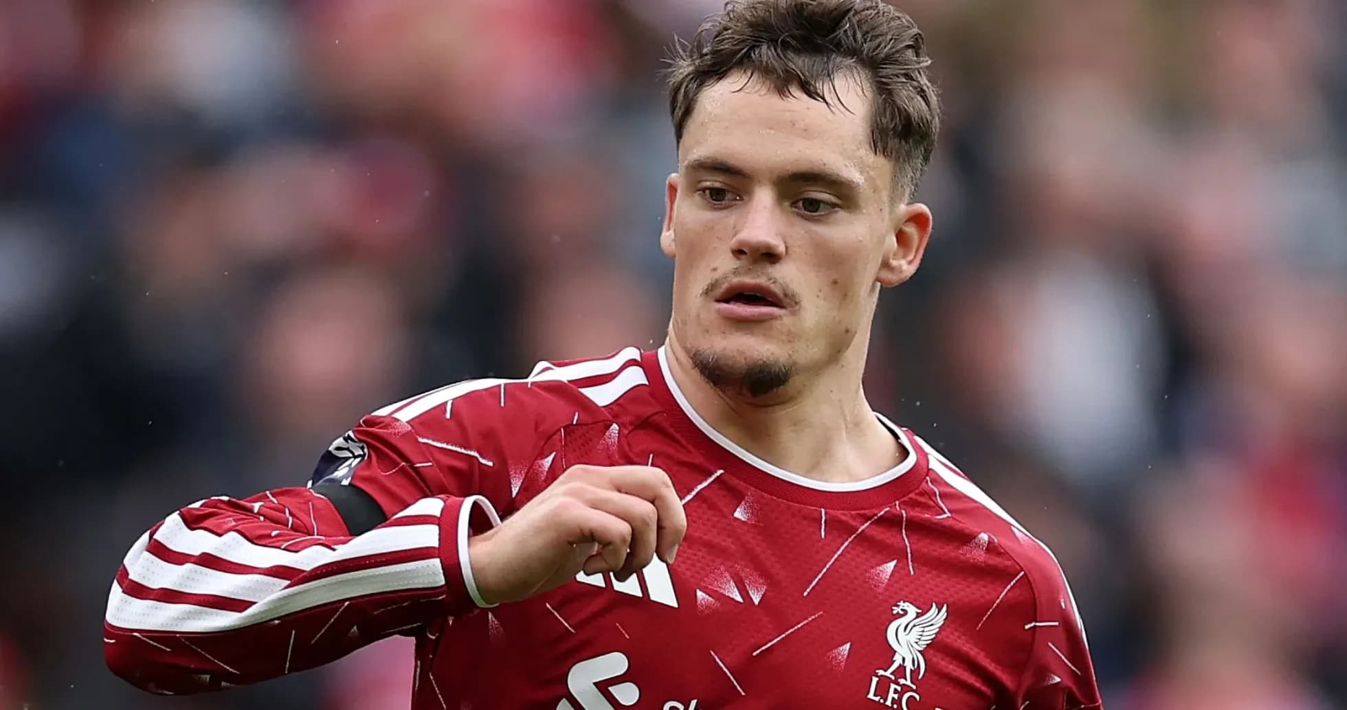 Player in Liverpool kit gestures during match Player in Liverpool kit gestures during match