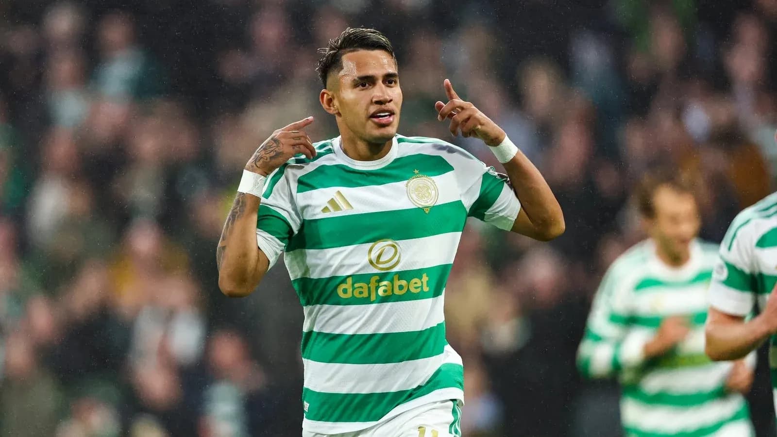 Celtic player celebrating a goal during match Celtic player celebrating a goal during match