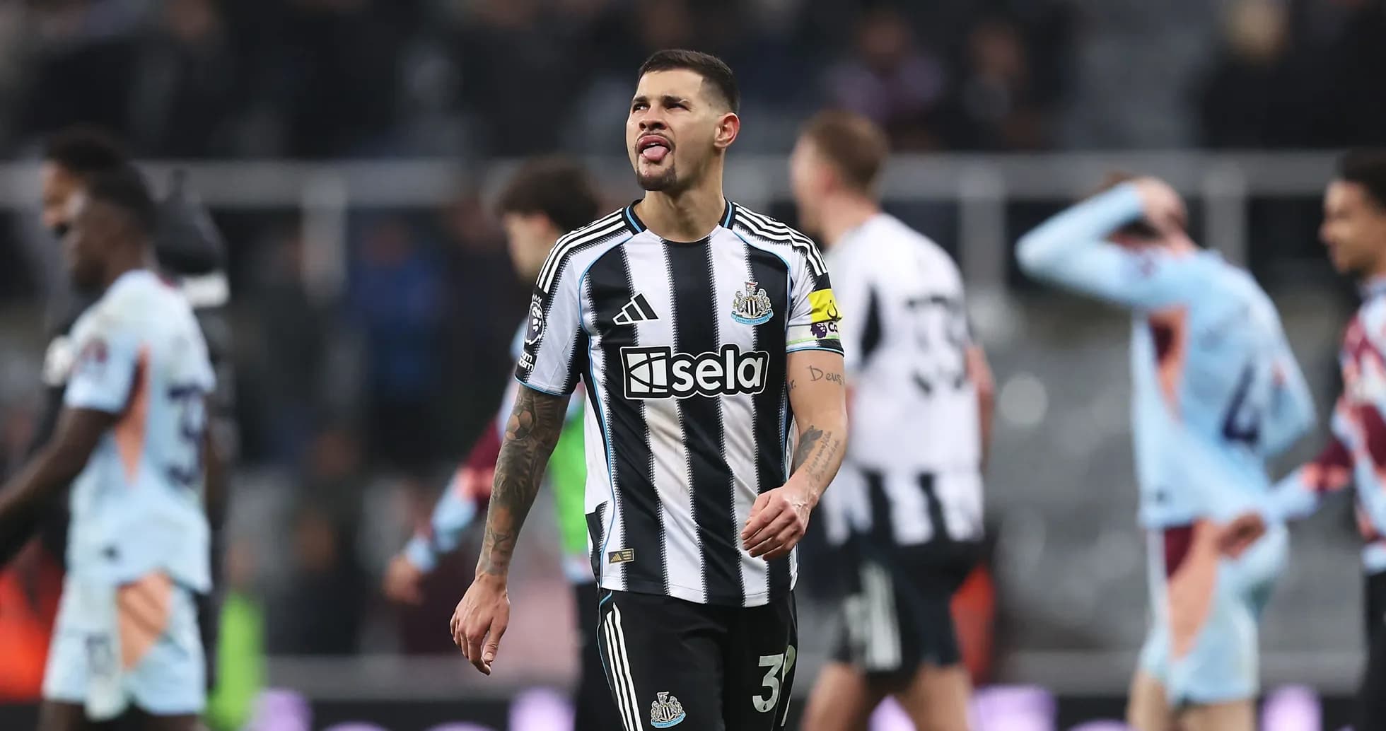 Newcastle player walking off the pitch after match Newcastle player walking off the pitch after match