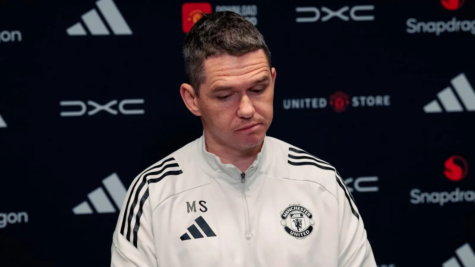 Manchester United manager at press conference podium Manchester United manager at press conference podium