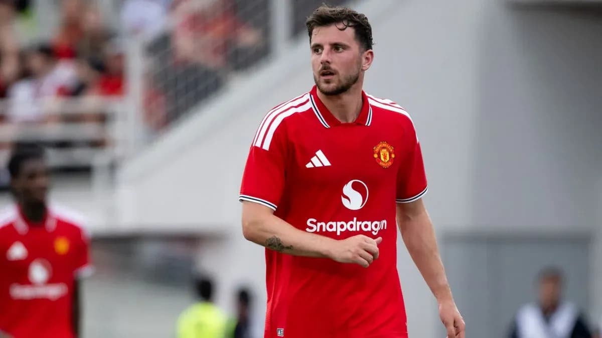 Player in red Manchester United kit on the field Player in red Manchester United kit on the field