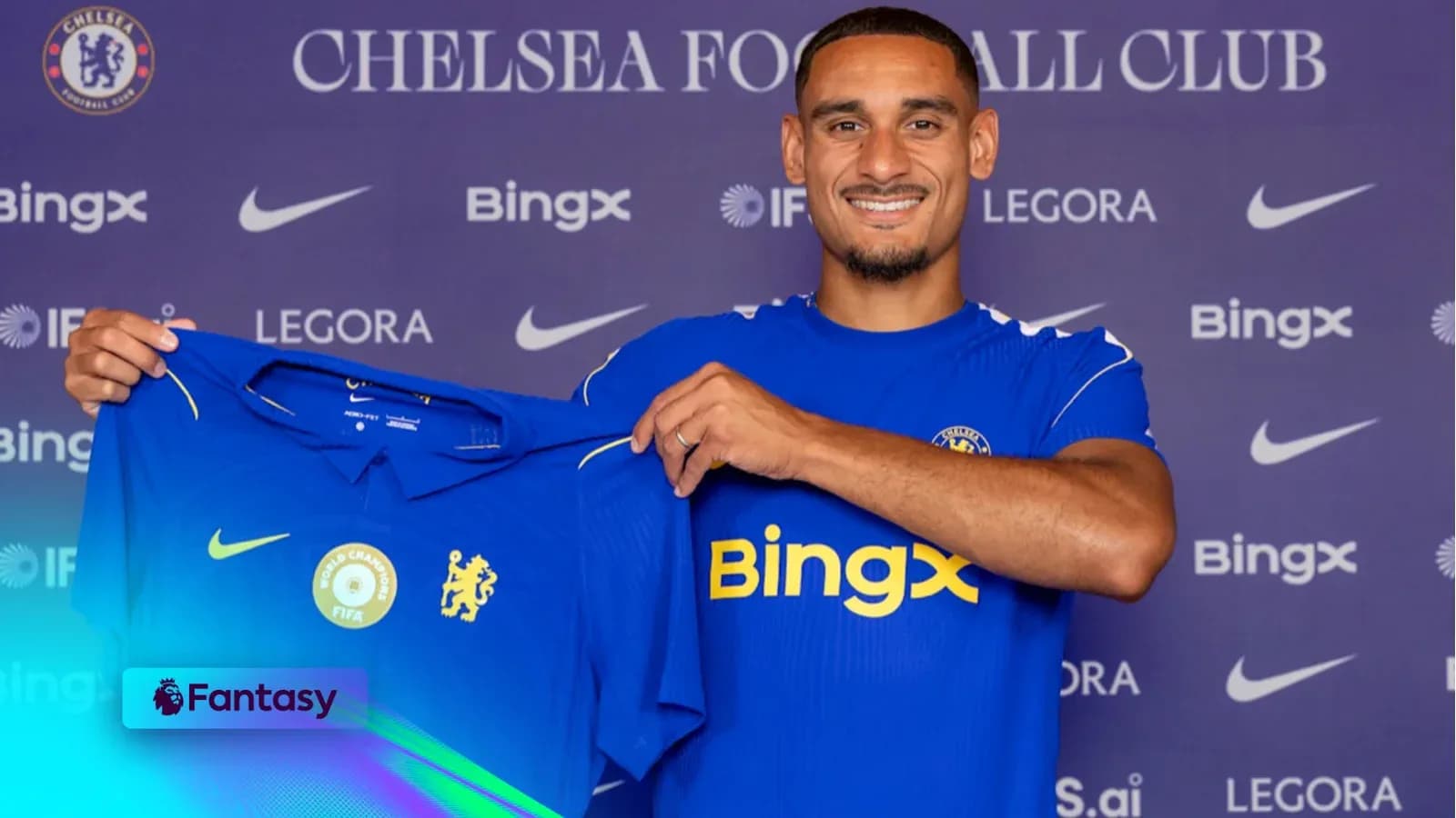 Player holding Chelsea FC jersey at press event Player holding Chelsea FC jersey at press event