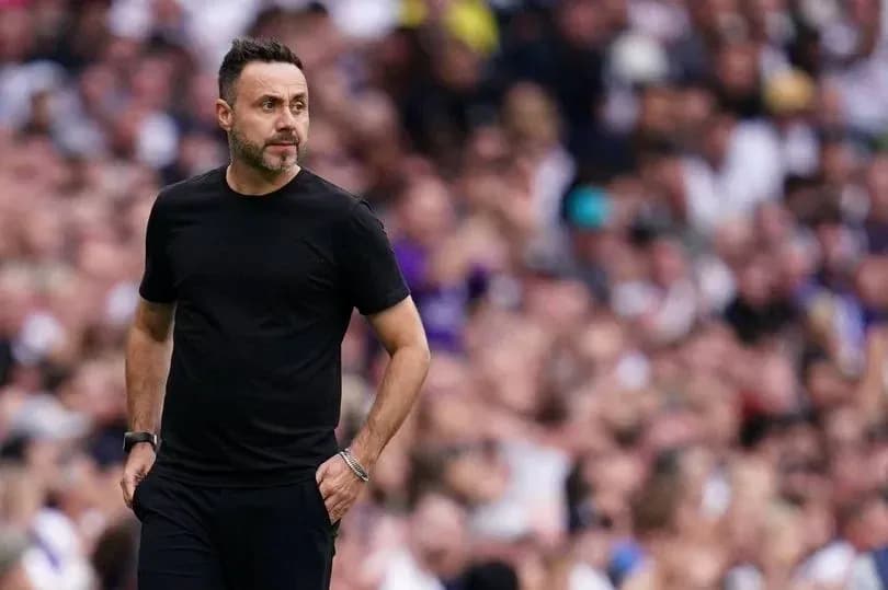 Coach walking on the sideline during match Coach walking on the sideline during match