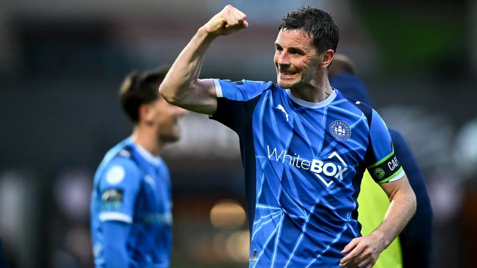 Player celebrating victory in Waterford FC jersey Player celebrating victory in Waterford FC jersey