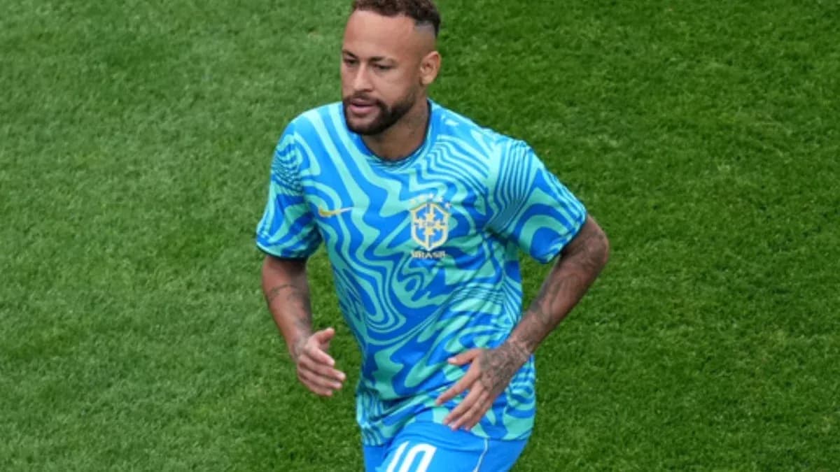Player running on field in Brazil training kit Player running on field in Brazil training kit