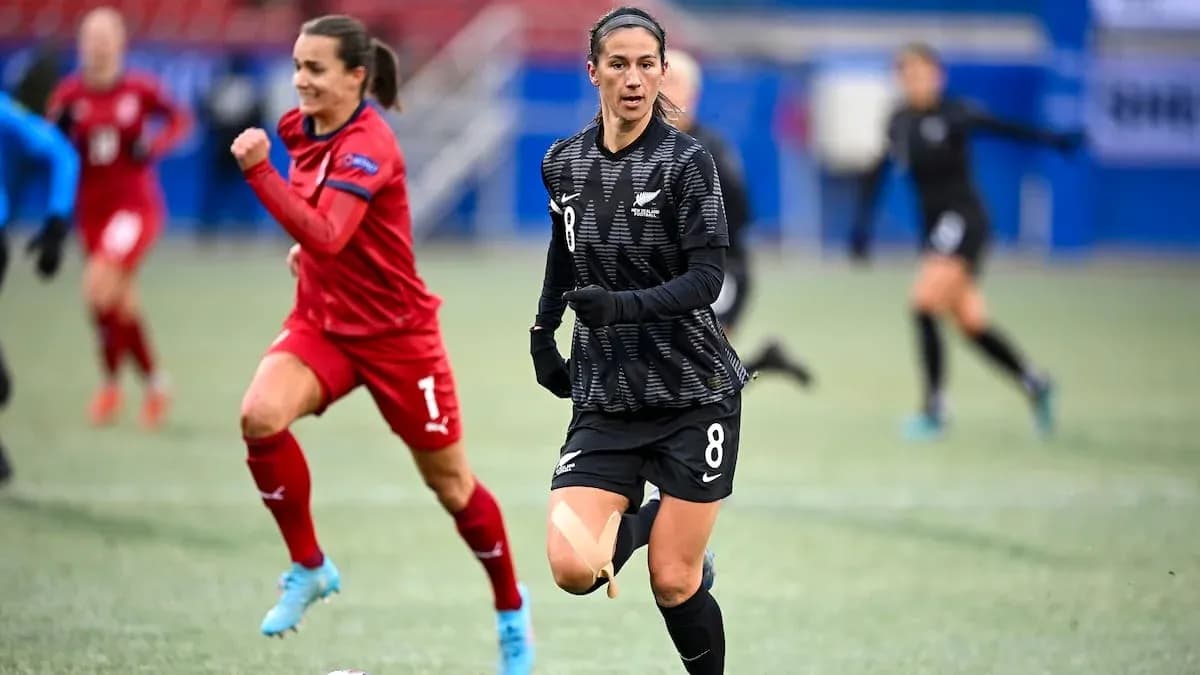 Player wearing black jersey running on soccer field Player wearing black jersey running on soccer field