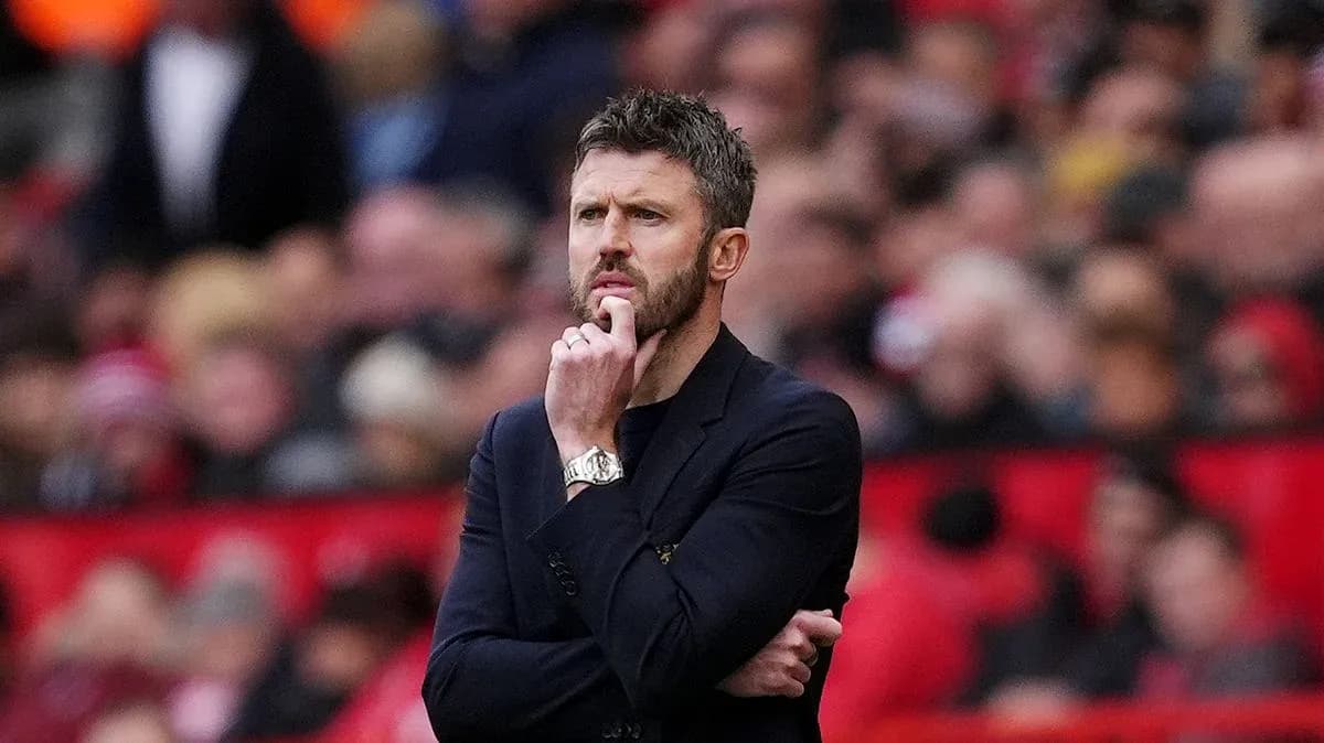 Manager contemplating during a match at stadium Manager contemplating during a match at stadium
