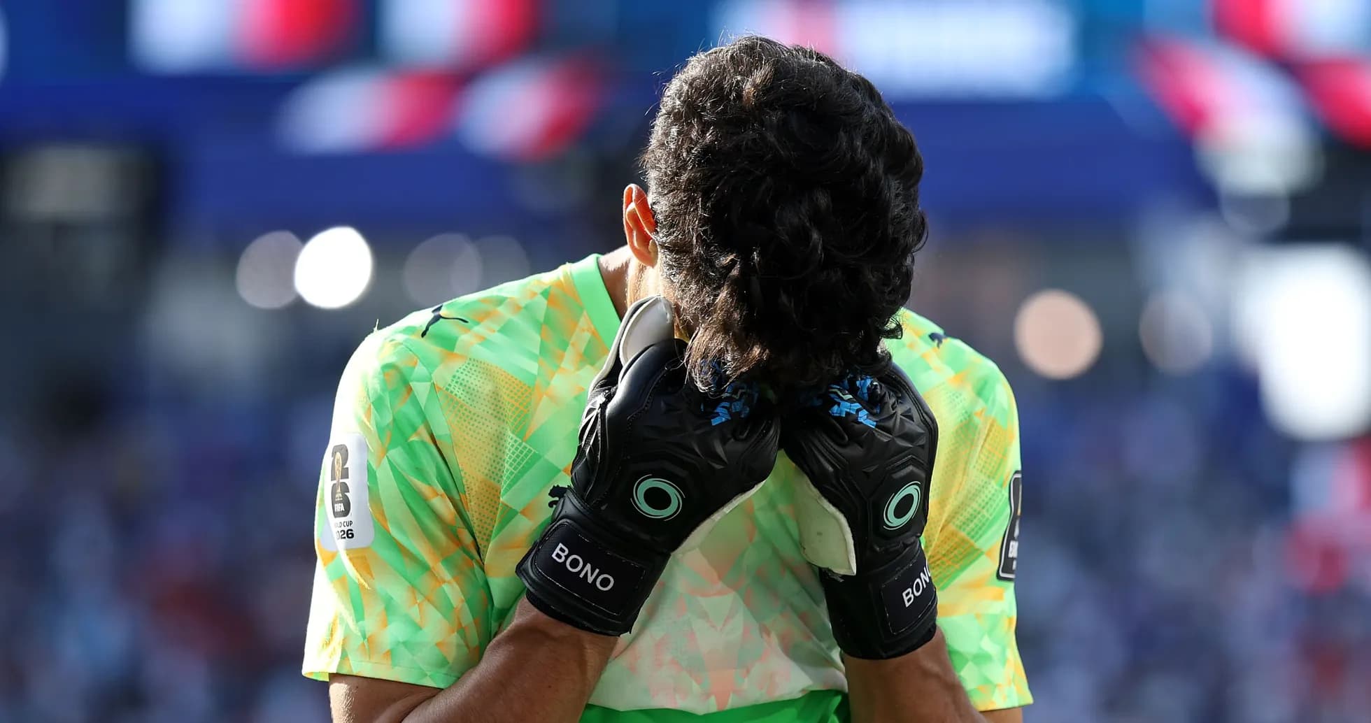 Goalkeeper holding head with gloves during match Goalkeeper holding head with gloves during match
