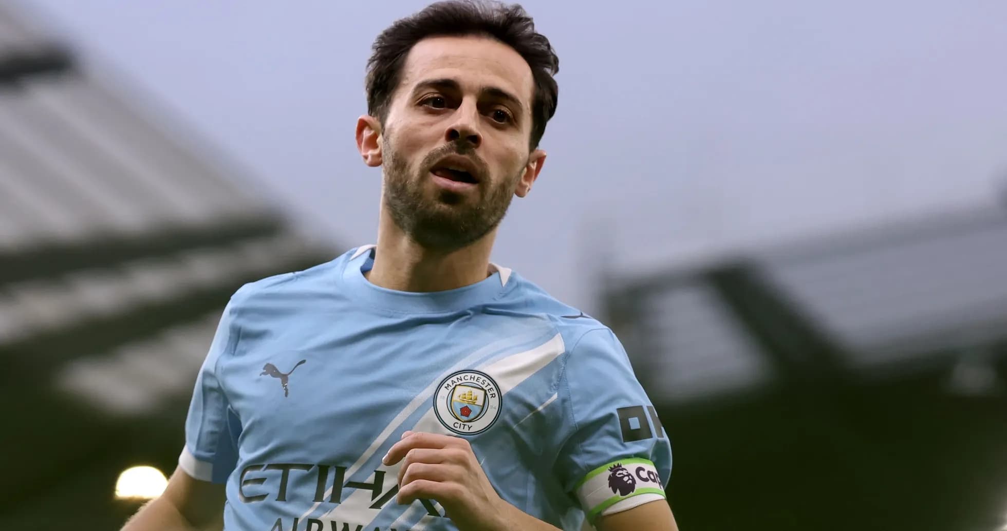 Player running in Manchester City home kit Player running in Manchester City home kit