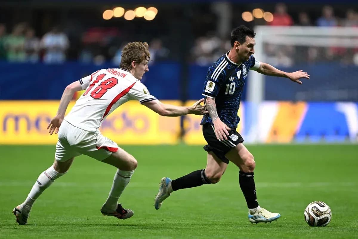 Player in blue jersey evading opponent during match Player in blue jersey evading opponent during match