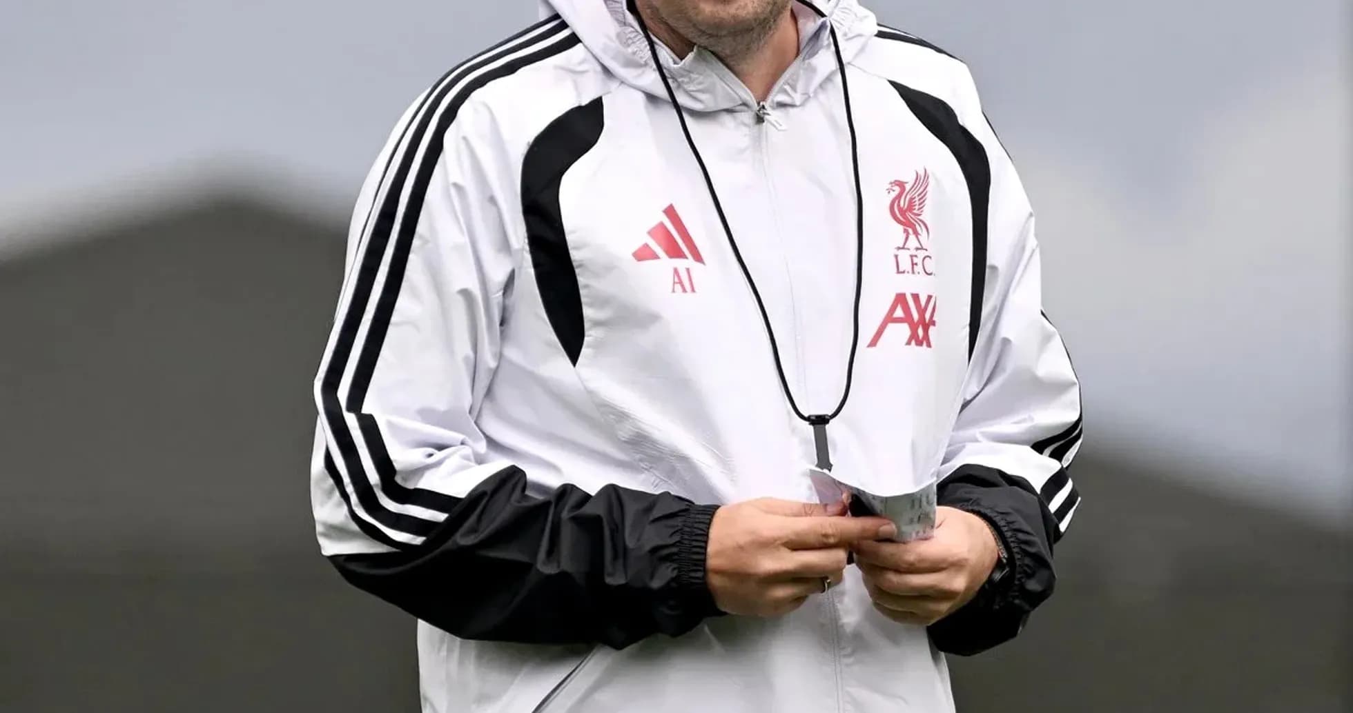Coach walking during Liverpool training session Coach walking during Liverpool training session
