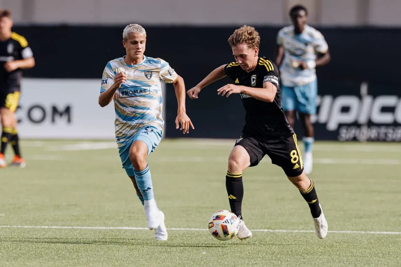 Players competing for the ball in MLS Next Pro match Players competing for the ball in MLS Next Pro match