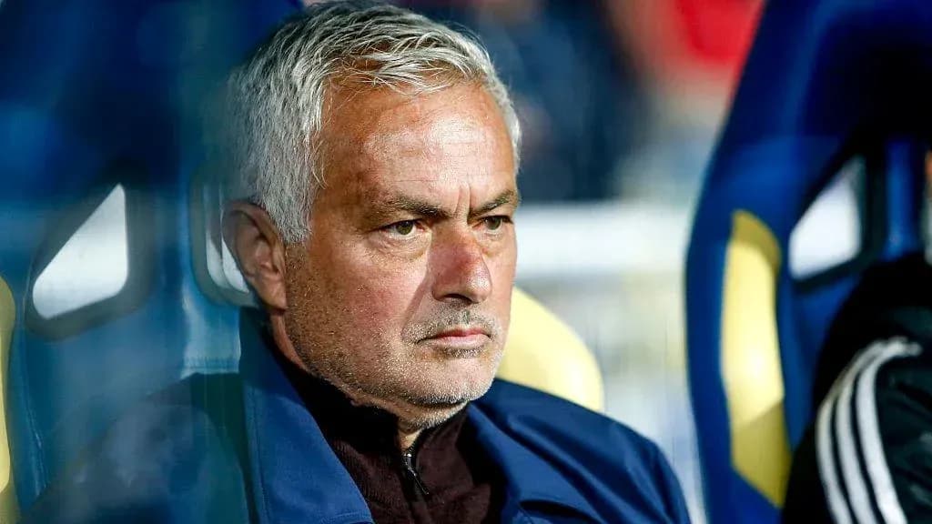 Manager seated on bench during a match Manager seated on bench during a match