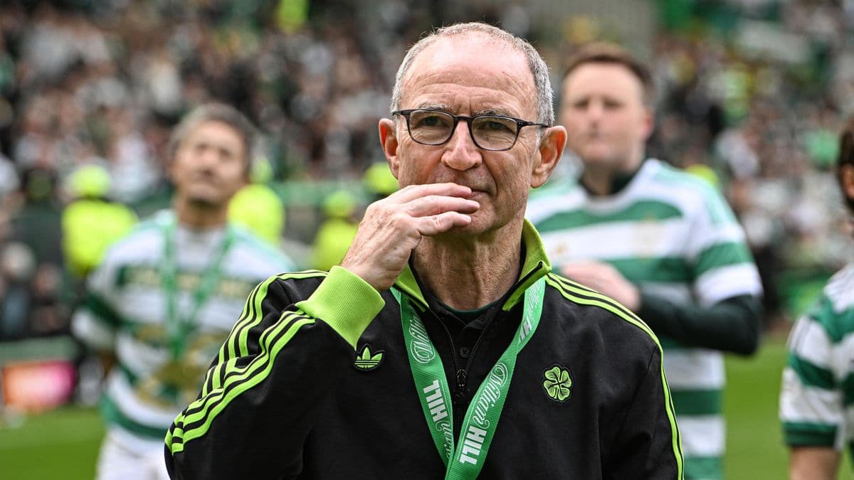 Manager with glasses on field during celebration Manager with glasses on field during celebration