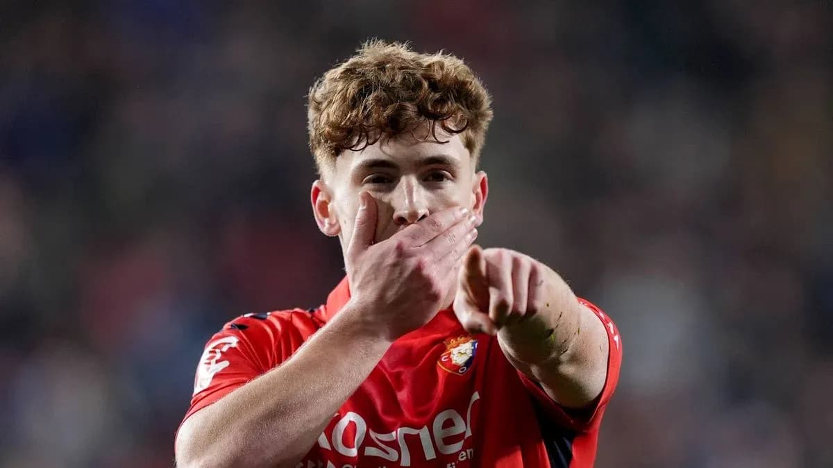 Player celebrating with a hand gesture on field Player celebrating with a hand gesture on field