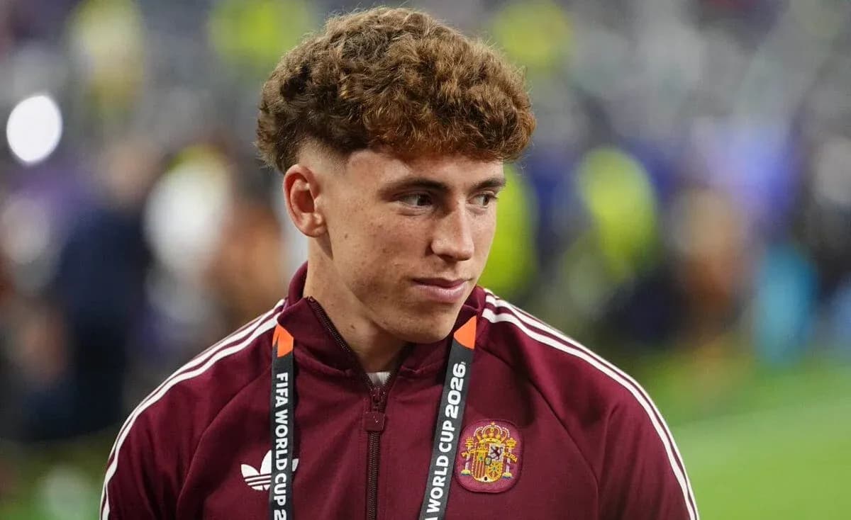 Player in maroon jacket at FIFA World Cup event Player in maroon jacket at FIFA World Cup event
